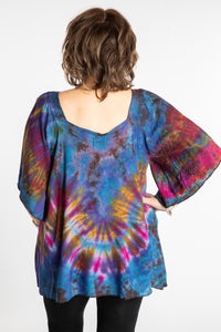 Betty is wearing the Purple Benya Tie Dye Butterfly Top