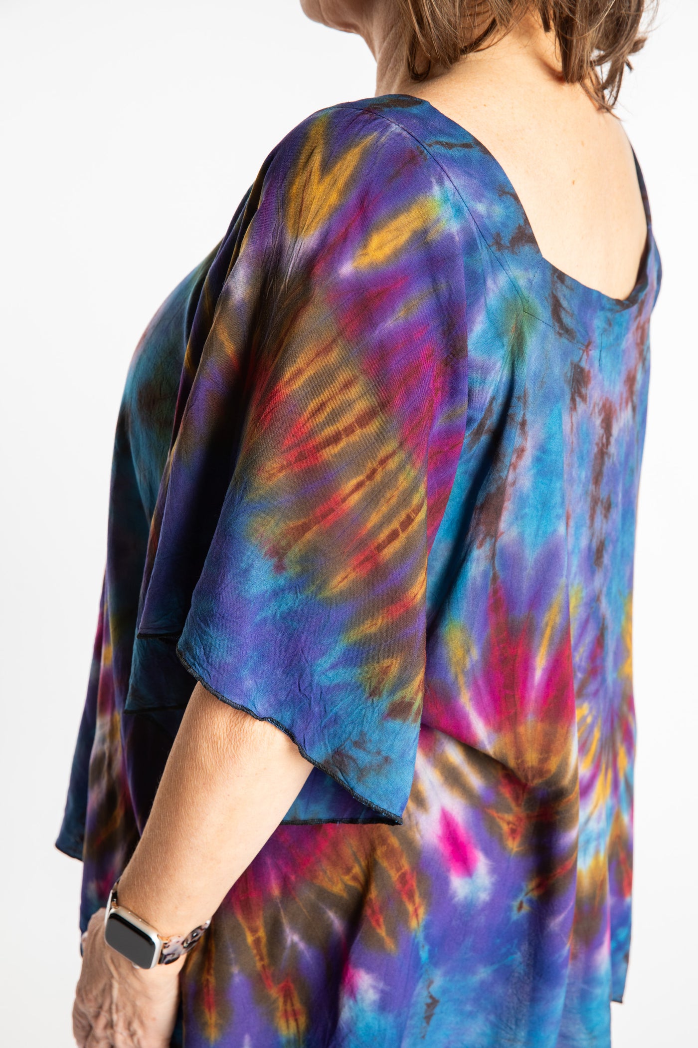 Betty is wearing the Purple Benya Tie Dye Butterfly Top