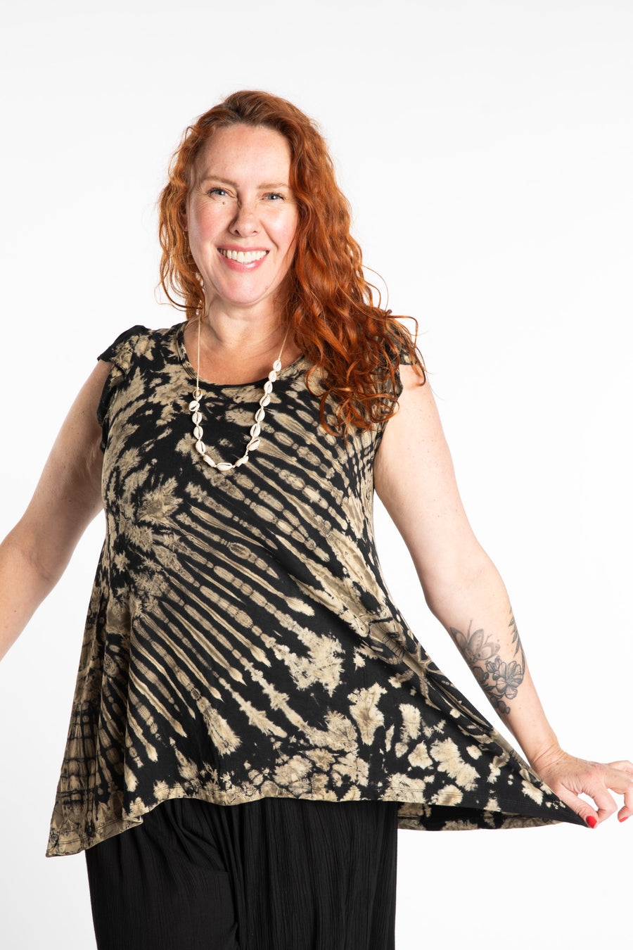 Maggie is wearing the Black and White Tie Dye Flutter Sleeve Top