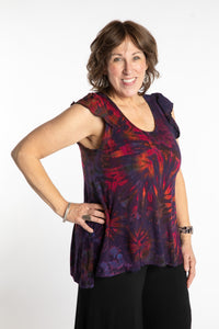 Betty is wearing the Purple Eggplant Tie Dye Flutter Sleeve Top