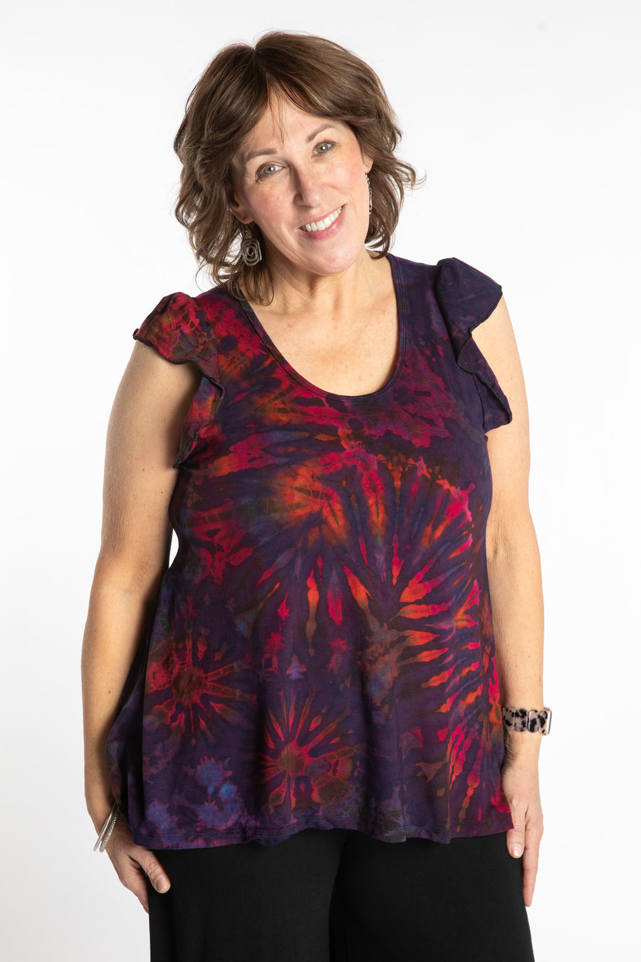 Betty is wearing the Purple Eggplant Tie Dye Flutter Sleeve Top