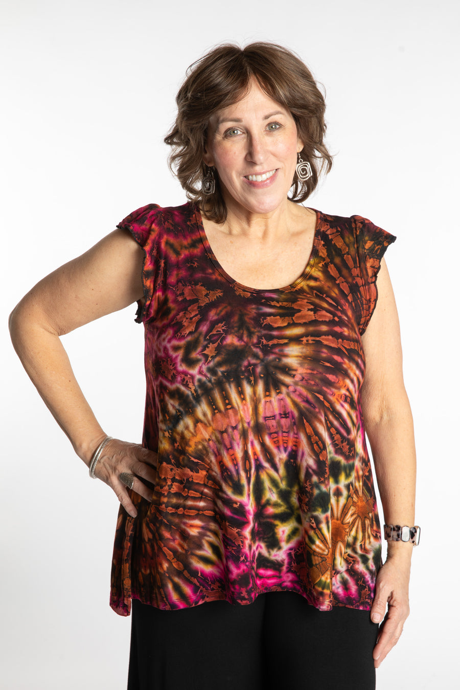 Betty is wearing the Orange Sunset Tie Dye Flutter Sleeve Top