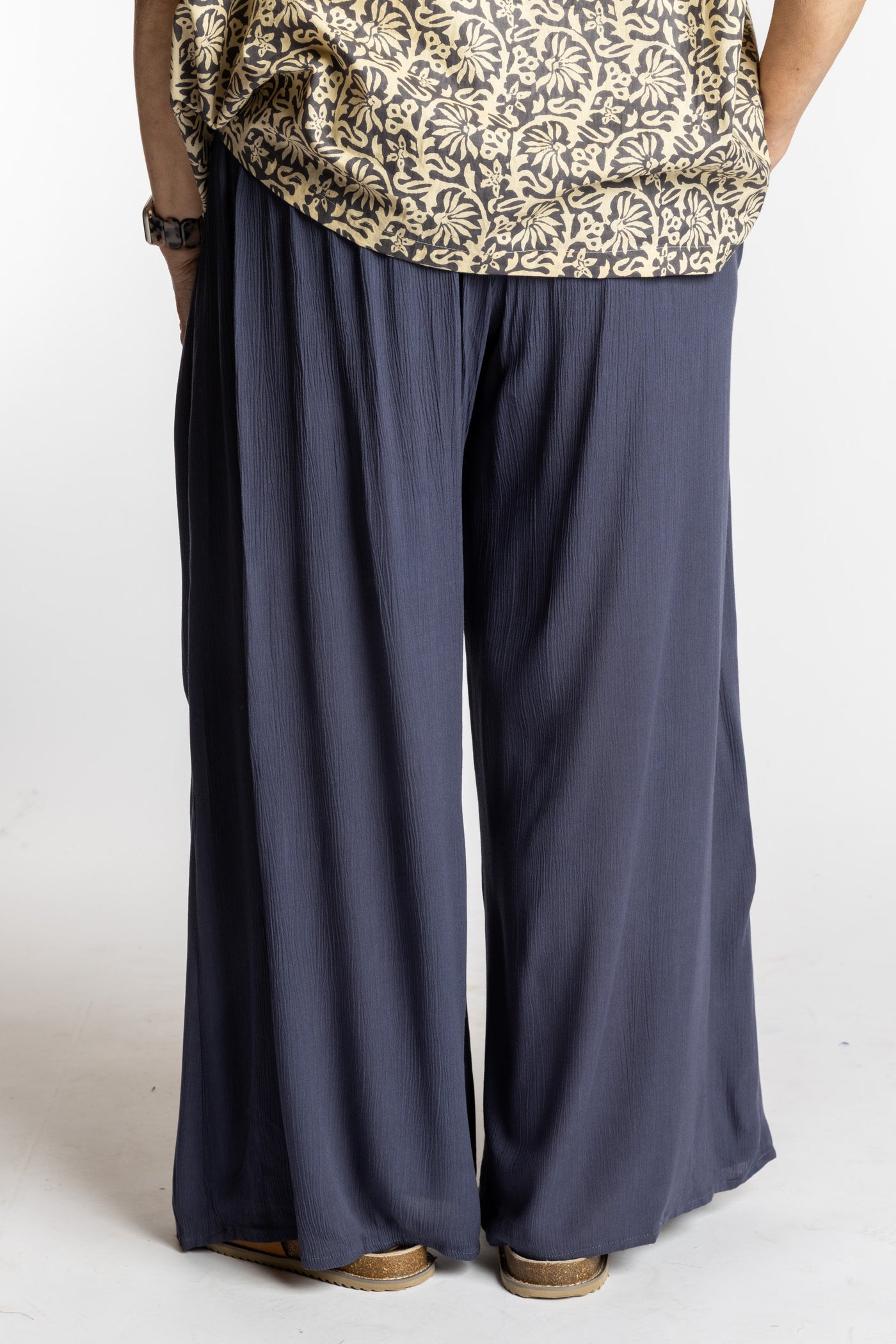 Betty is wearing the M/L Gray Penny Lane bohemian wide leg Pants