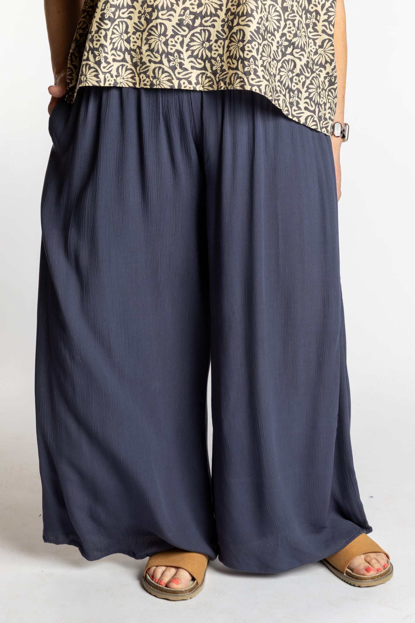 Betty is wearing the M/L Gray Penny Lane bohemian wide leg Pants