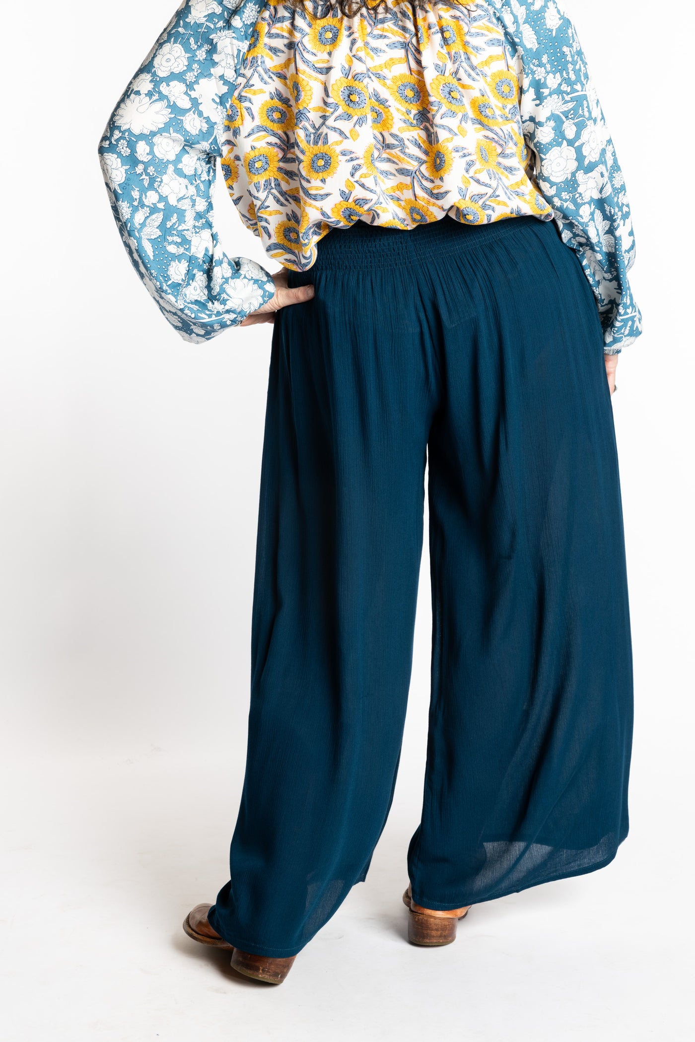 Susan is wearing the M/L blue Ocean Penny Lane bohemian wide leg Pants