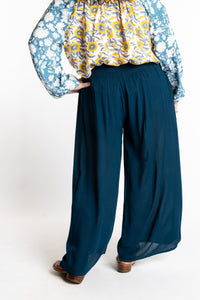 Susan is wearing the M/L blue Ocean Penny Lane bohemian wide leg Pants