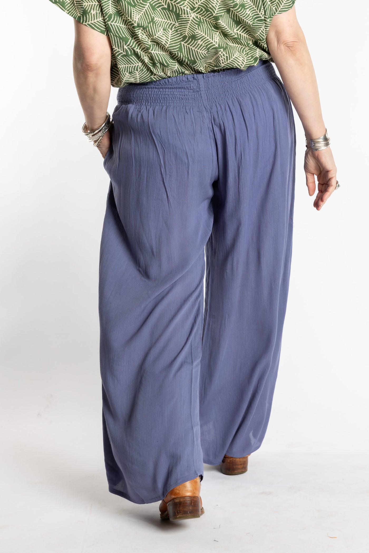 Susan is wearing the M/L blue Periwinkle Penny Lane bohemian wide leg Pants