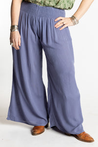 Susan is wearing the M/L blue Periwinkle Penny Lane bohemian wide leg Pants