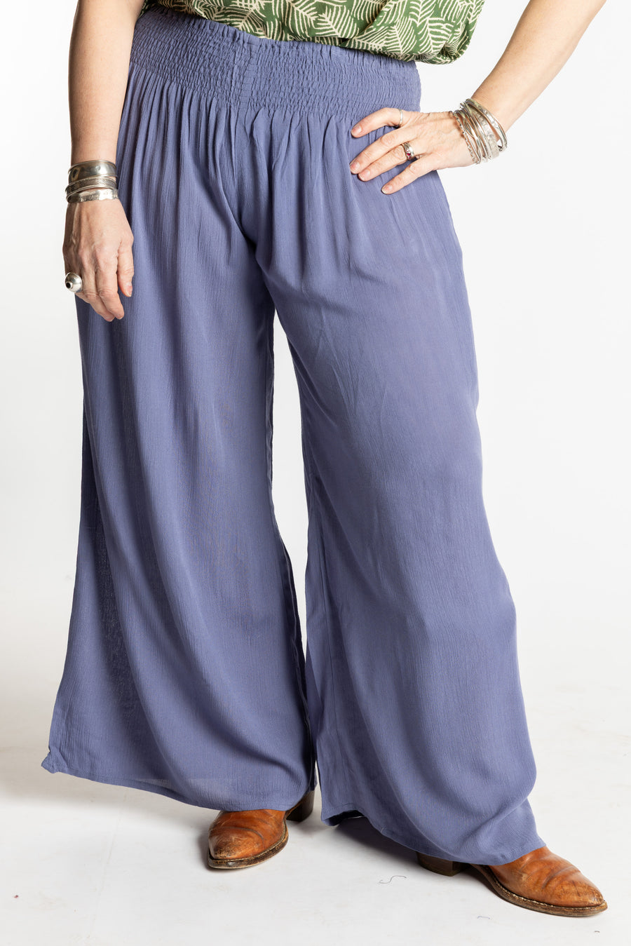 Susan is wearing the M/L blue Periwinkle Penny Lane bohemian wide leg Pants