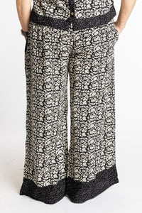 Betty wearing size M/L Black Primrose floral Penny Lane contrast hem wide leg pants