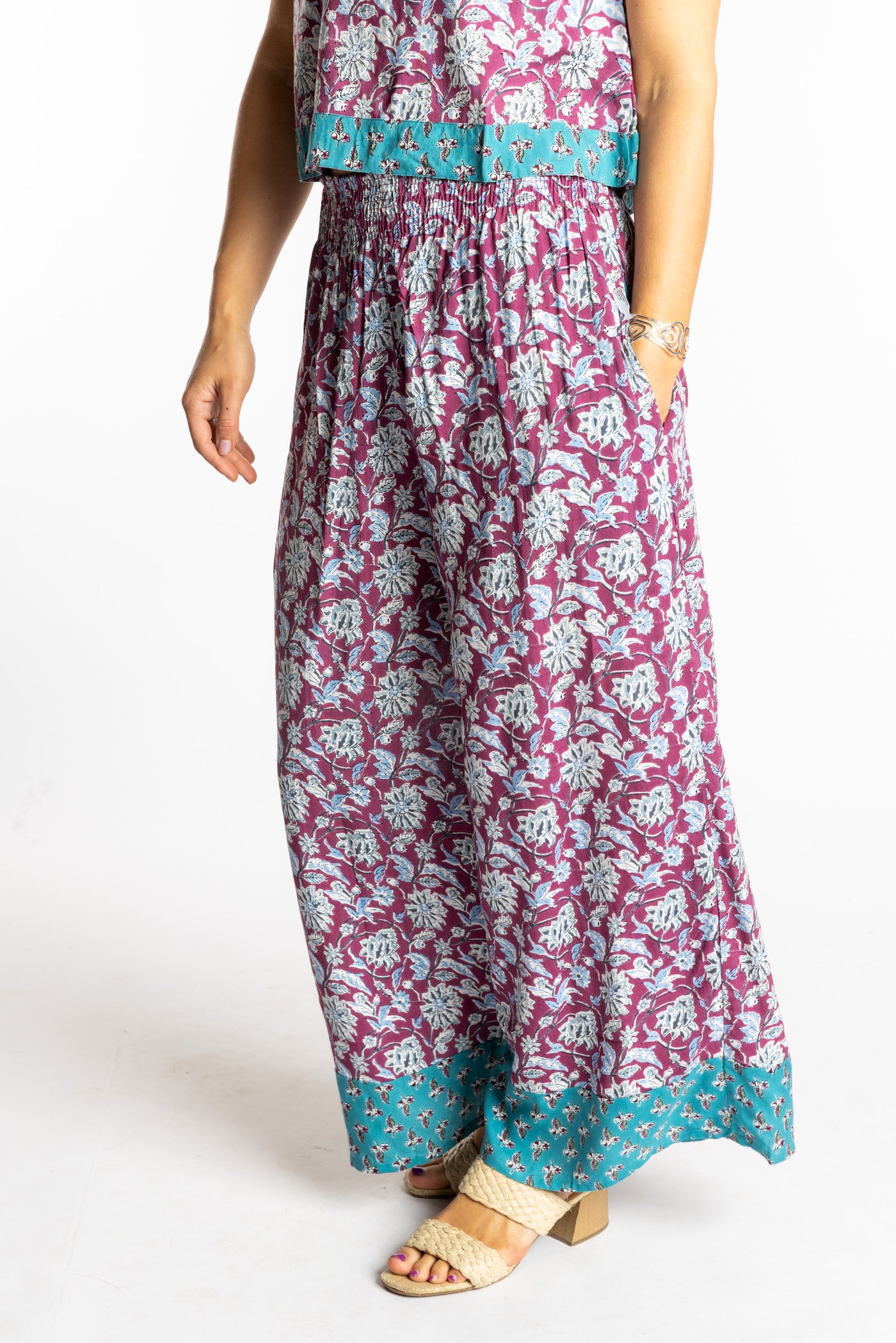 Sophie wearing size S/M Burgundy floral Penny Lane contrast hem wide leg pants with sleeveless boho top