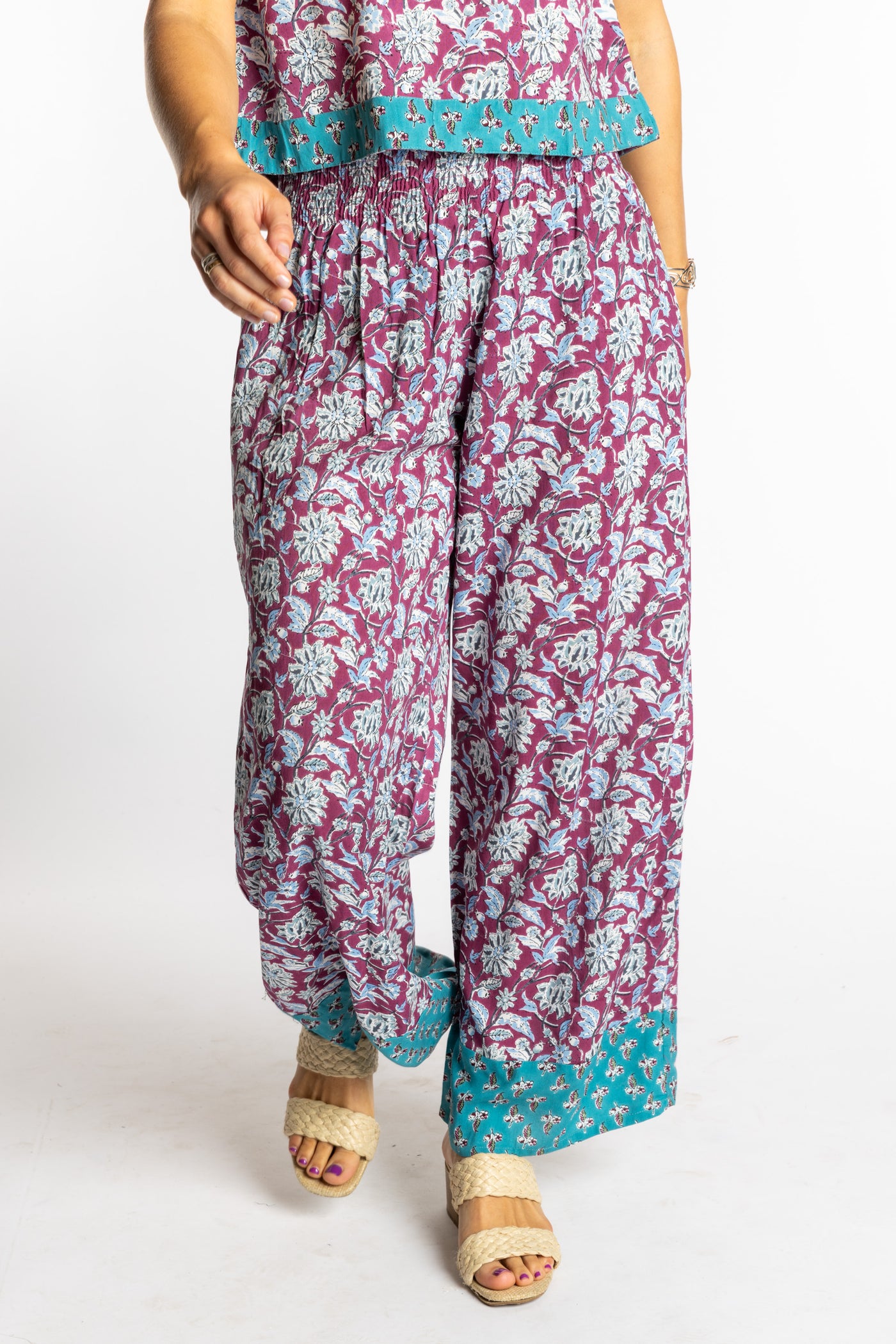 Sophie wearing size S/M Burgundy floral Penny Lane contrast hem wide leg pants with sleeveless boho top