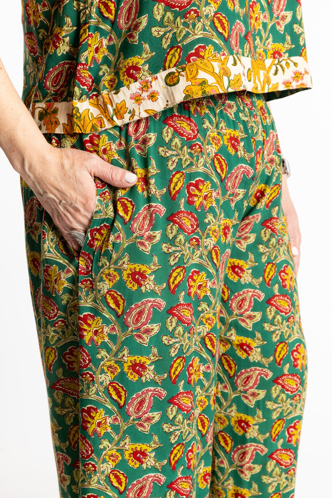 Betty wearing size M/L Forest Green floral Penny Lane contrast hem wide leg pants