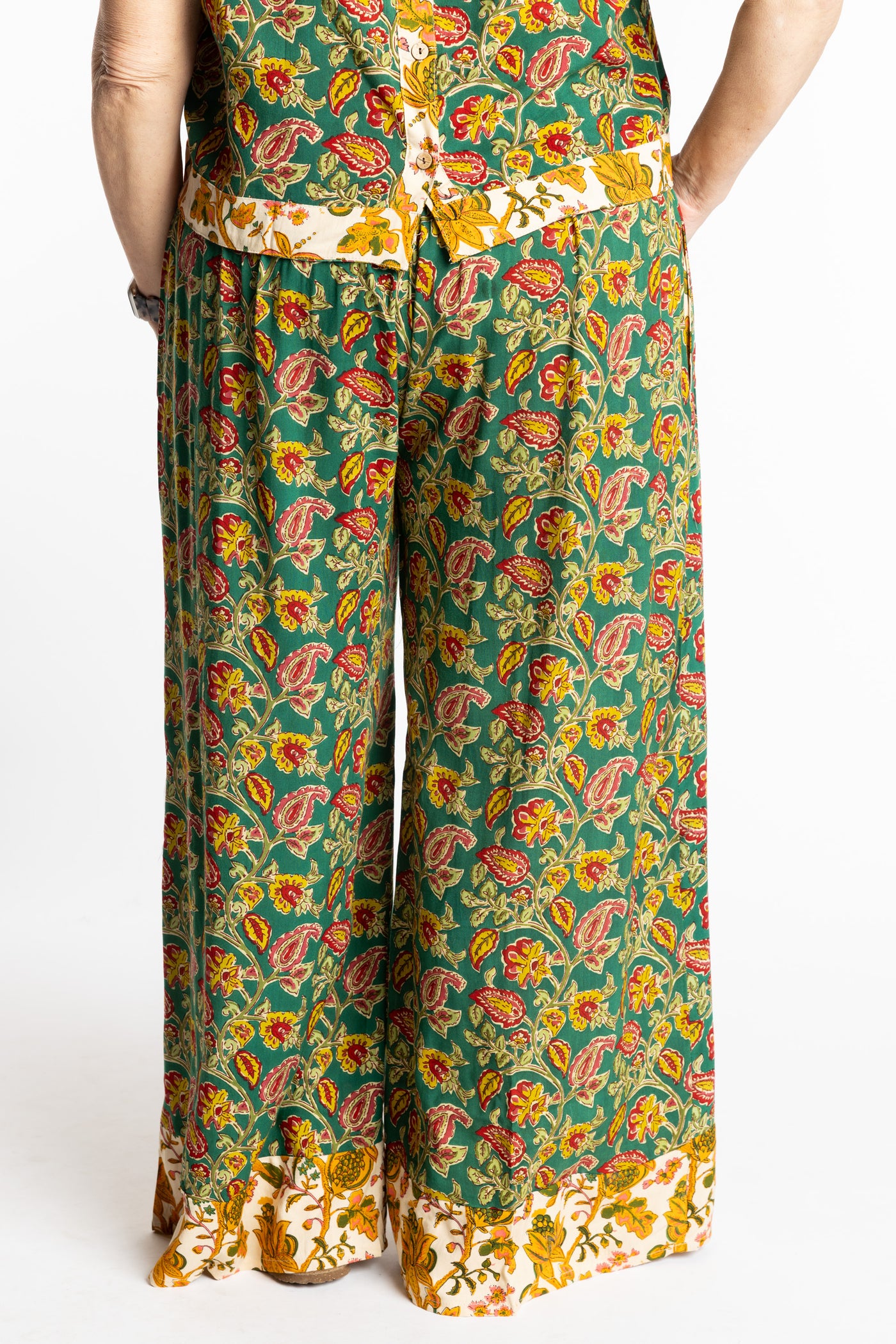 Betty wearing size M/L Forest Green floral Penny Lane contrast hem wide leg pants