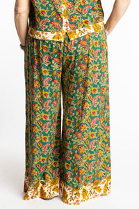 Betty wearing size M/L Forest Green floral Penny Lane contrast hem wide leg pants