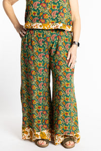 Betty wearing size M/L Forest Green floral Penny Lane contrast hem wide leg pants