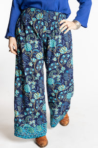 Susan wearing size M/L Navy blue floral Penny Lane contrast hem wide leg pants