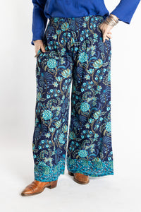 Susan wearing size M/L Navy blue floral Penny Lane contrast hem wide leg pants