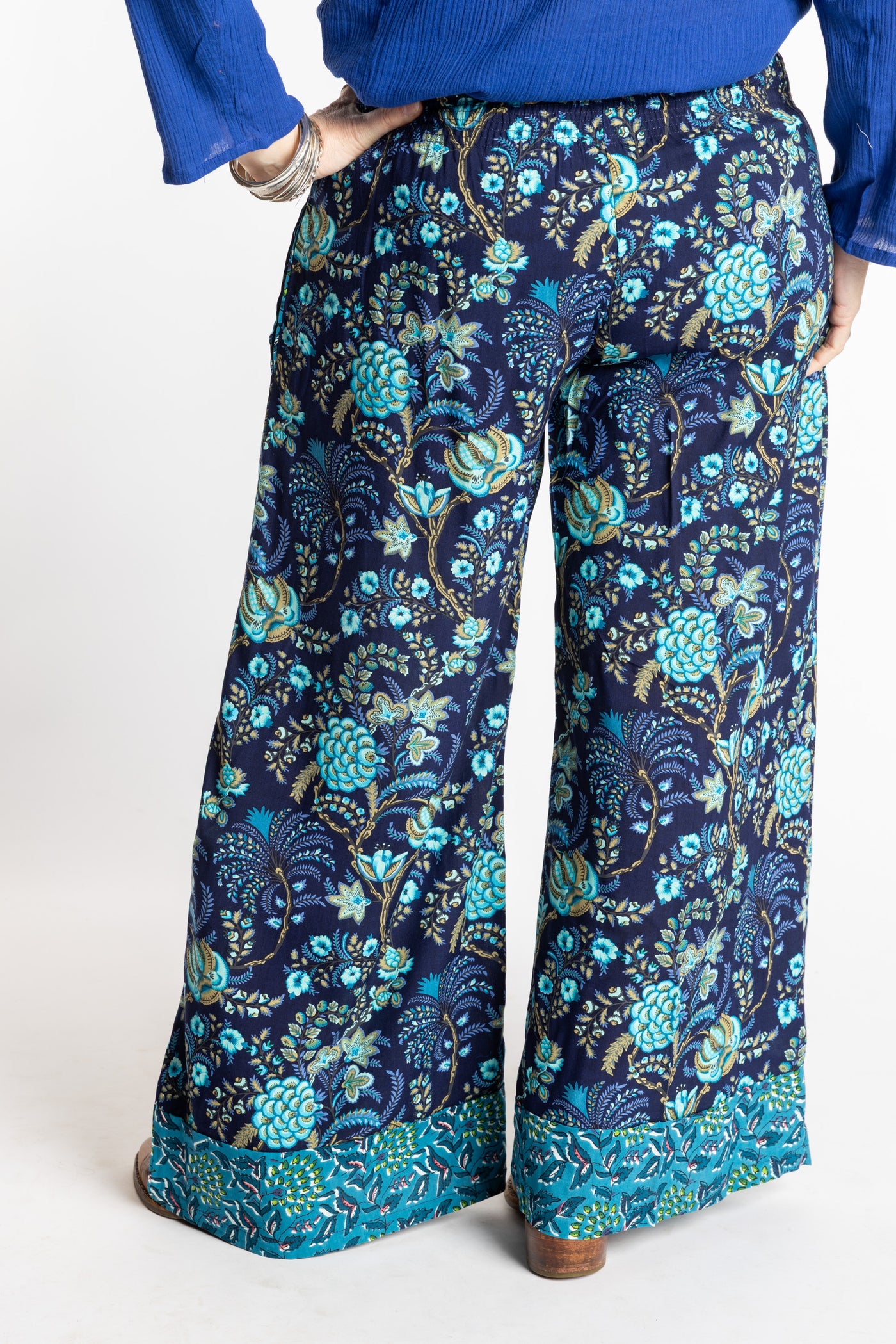Susan wearing size M/L Navy blue floral Penny Lane contrast hem wide leg pants