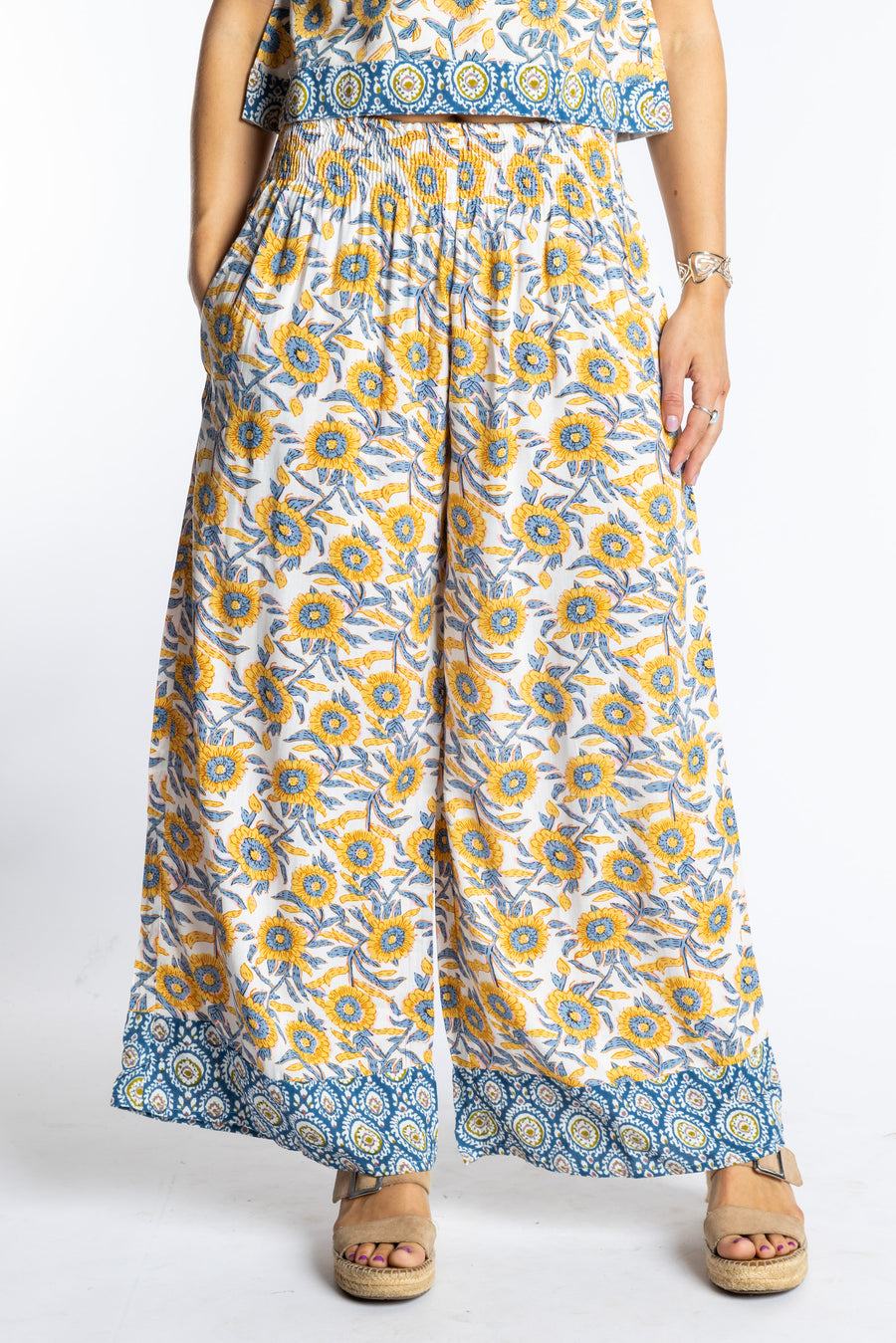Sophie wearing size S/M Sunflower floral Penny Lane contrast hem wide leg pants with sleeveless boho top