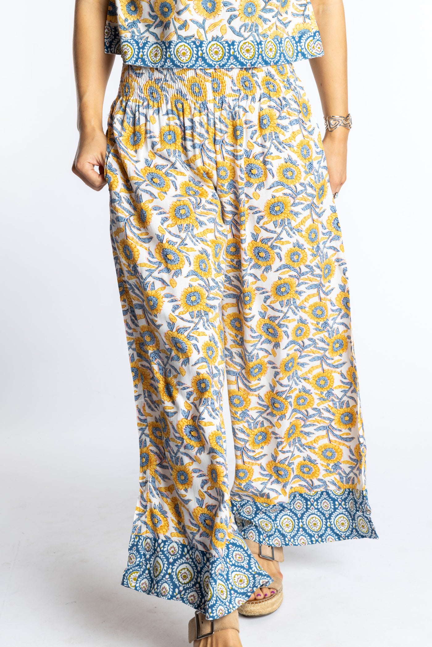 Sophie wearing size S/M Sunflower floral Penny Lane contrast hem wide leg pants with sleeveless boho top