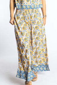 Sophie wearing size S/M Sunflower floral Penny Lane contrast hem wide leg pants with sleeveless boho top