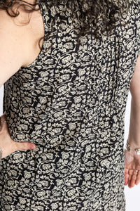 Susan is wearing the M/L Black Floral Primrose Boho Cotton Mini Printed Dress