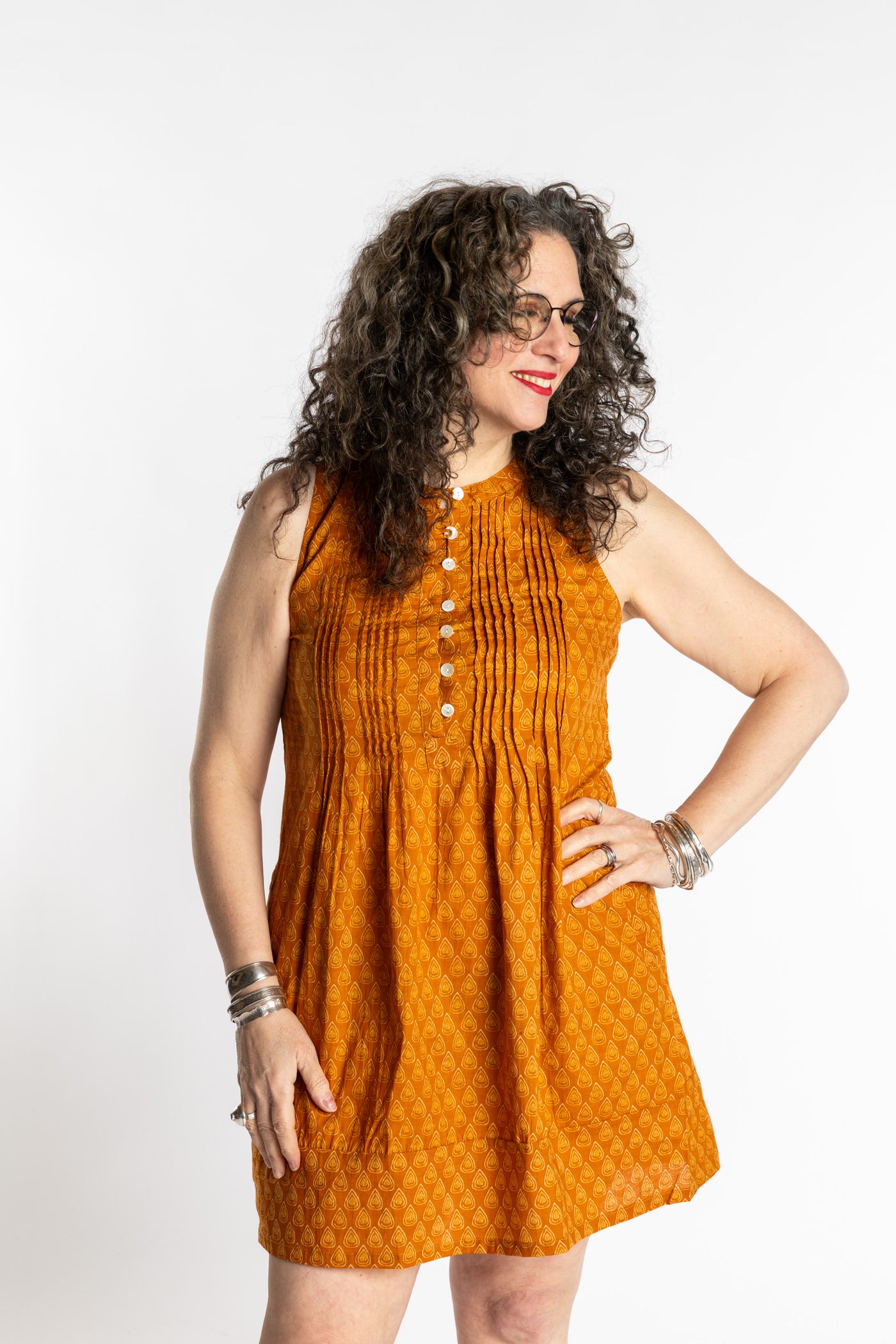 Susan is wearing the M/L Yellow Honeydrop Boho Cotton Mini Printed Dress