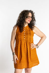 Susan is wearing the M/L Yellow Honeydrop Boho Cotton Mini Printed Dress