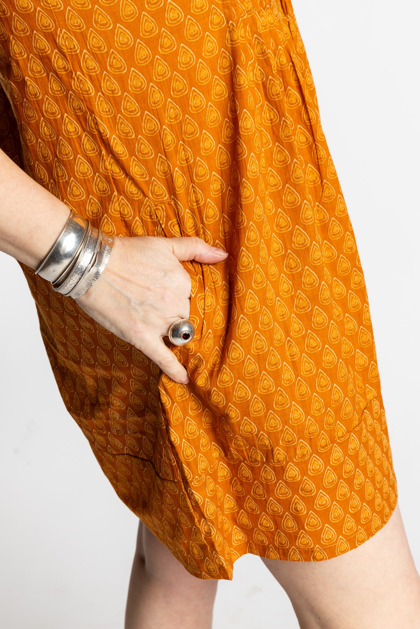 Susan is wearing the M/L Yellow Honeydrop Boho Cotton Mini Printed Dress