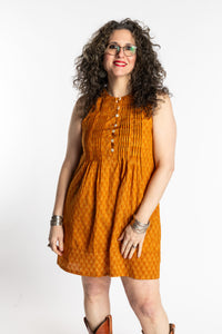 Susan is wearing the M/L Yellow Honeydrop Boho Cotton Mini Printed Dress