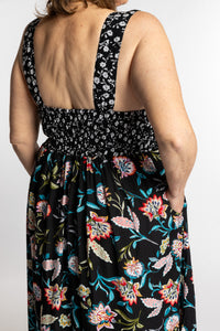 Betty wearing the L/XL black floral Flora Fusion maxi dress with smocked bodice and flowy skirt