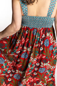 Susan wearing size M/L red floral Flora Fusion maxi dress with teal contrast top 