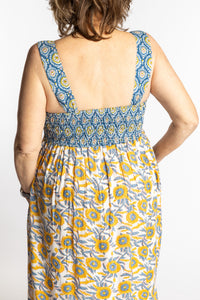 Betty wearing the L/XL Sunflower floral Flora Fusion maxi dress with smocked bodice and flowy skirt