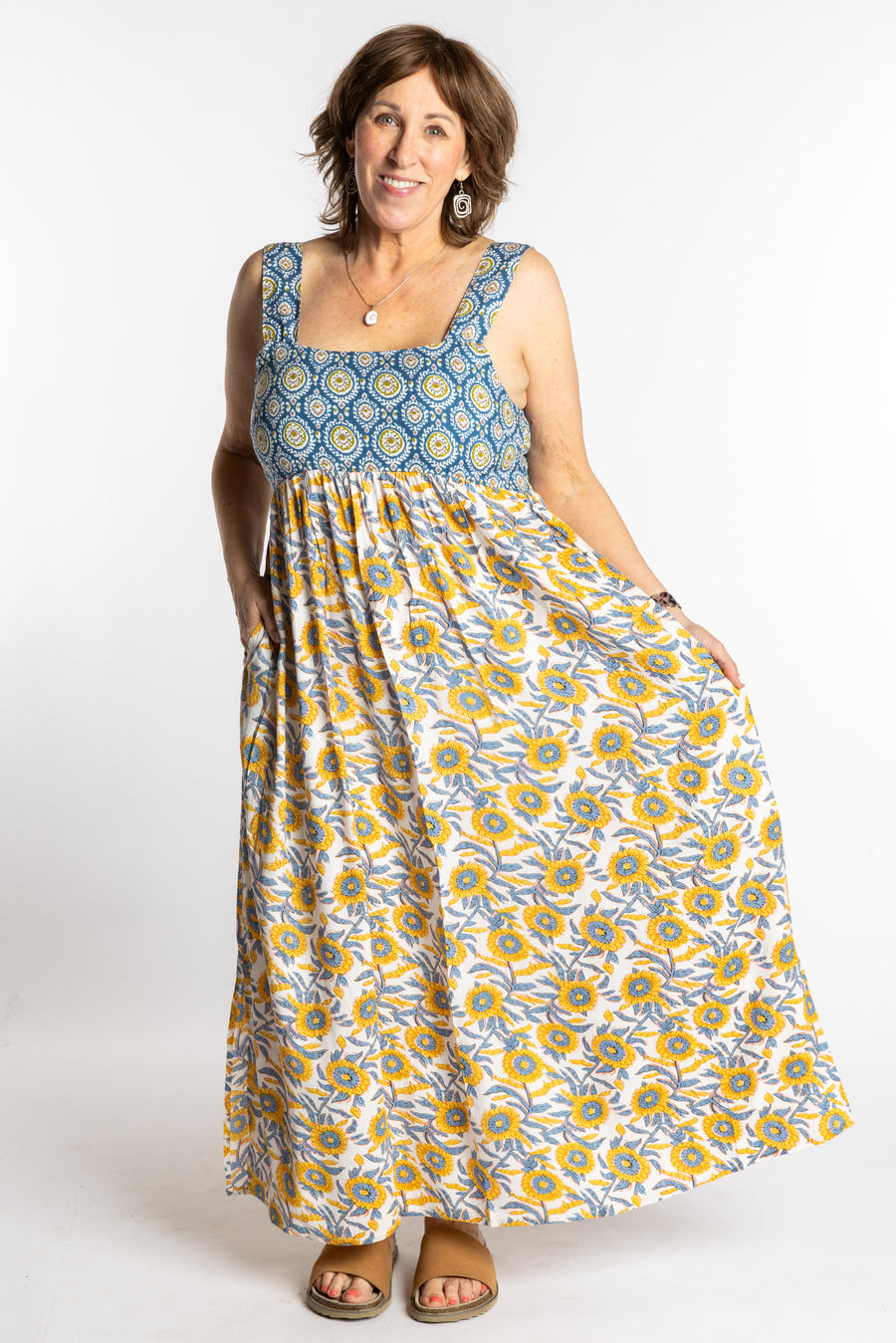 Betty wearing the L/XL Sunflower floral Flora Fusion maxi dress with smocked bodice and flowy skirt