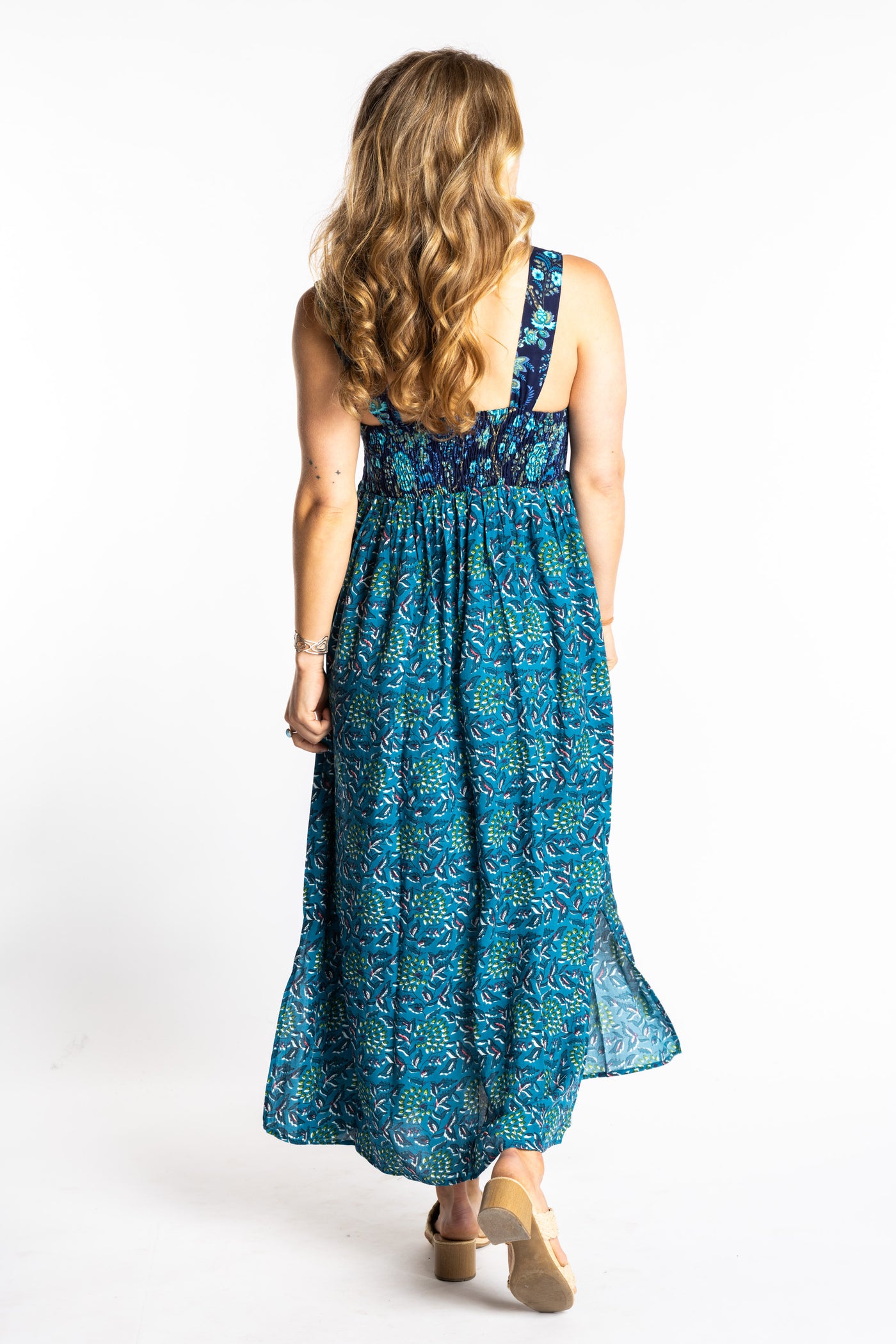 Sophie wearing the S/M teal floral Flora Fusion maxi dress with smocked bodice and flowy skirt