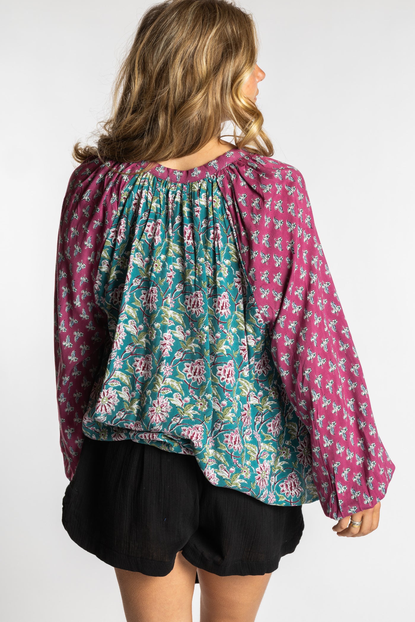 Sophie is wearing the mixed print aquamarine boho floral poet blouse top
