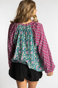 Sophie is wearing the mixed print aquamarine boho floral poet blouse top
