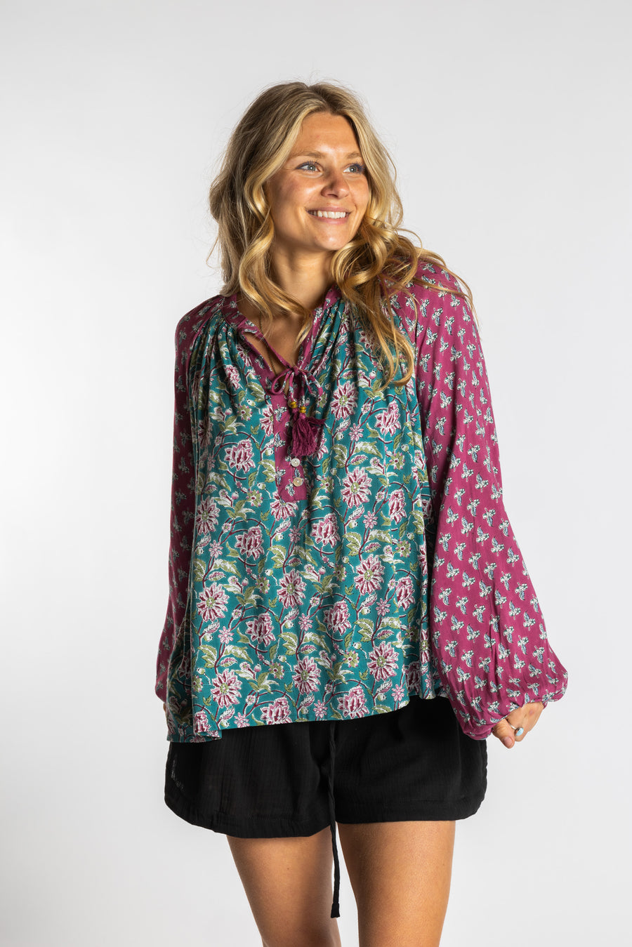 Sophie is wearing the mixed print aquamarine boho floral poet blouse top
