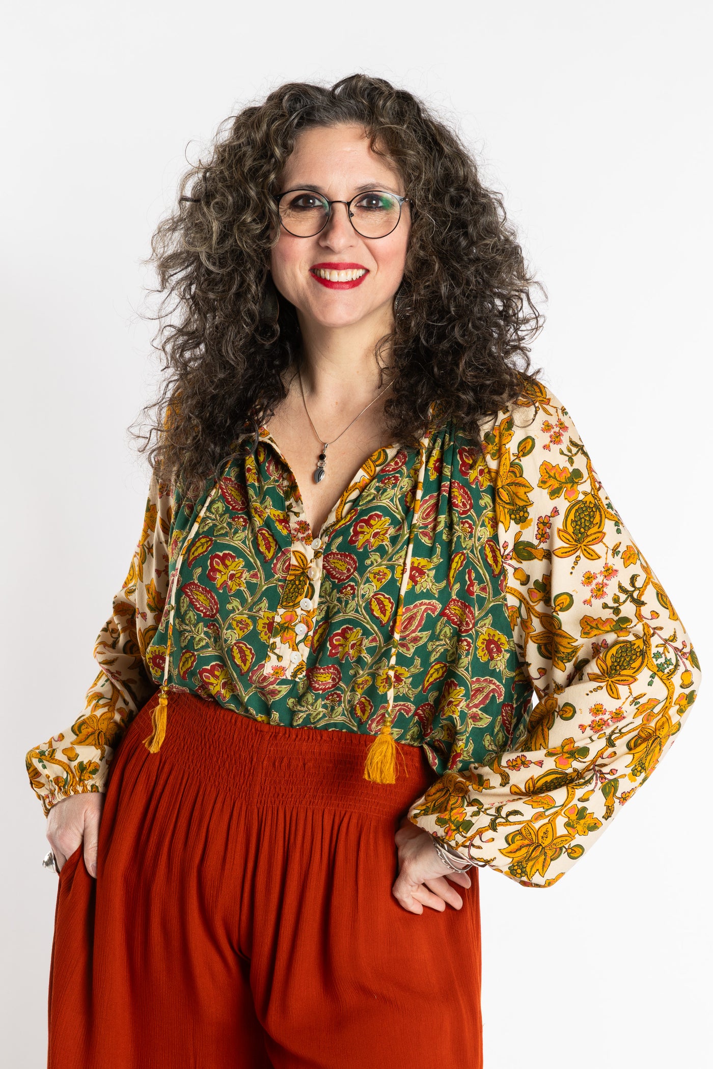 Susan is wearing the mixed print forest green boho floral poet blouse top
