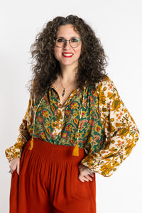 Susan is wearing the mixed print forest green boho floral poet blouse top
