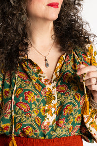 Susan is wearing the mixed print forest green boho floral poet blouse top
