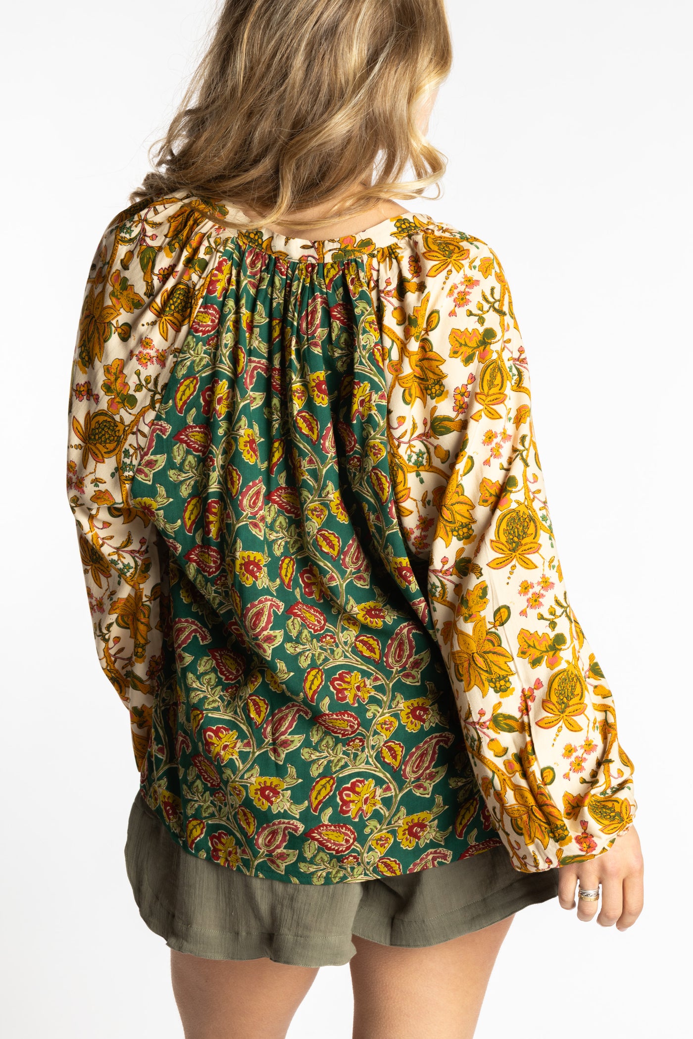 Sophie is wearing the mixed print forest green boho floral poet blouse top