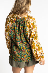 Sophie is wearing the mixed print forest green boho floral poet blouse top