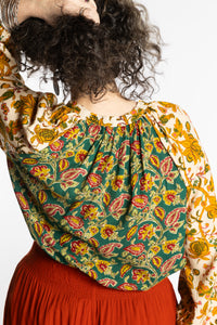 Susan is wearing the mixed print forest green boho floral poet blouse top
