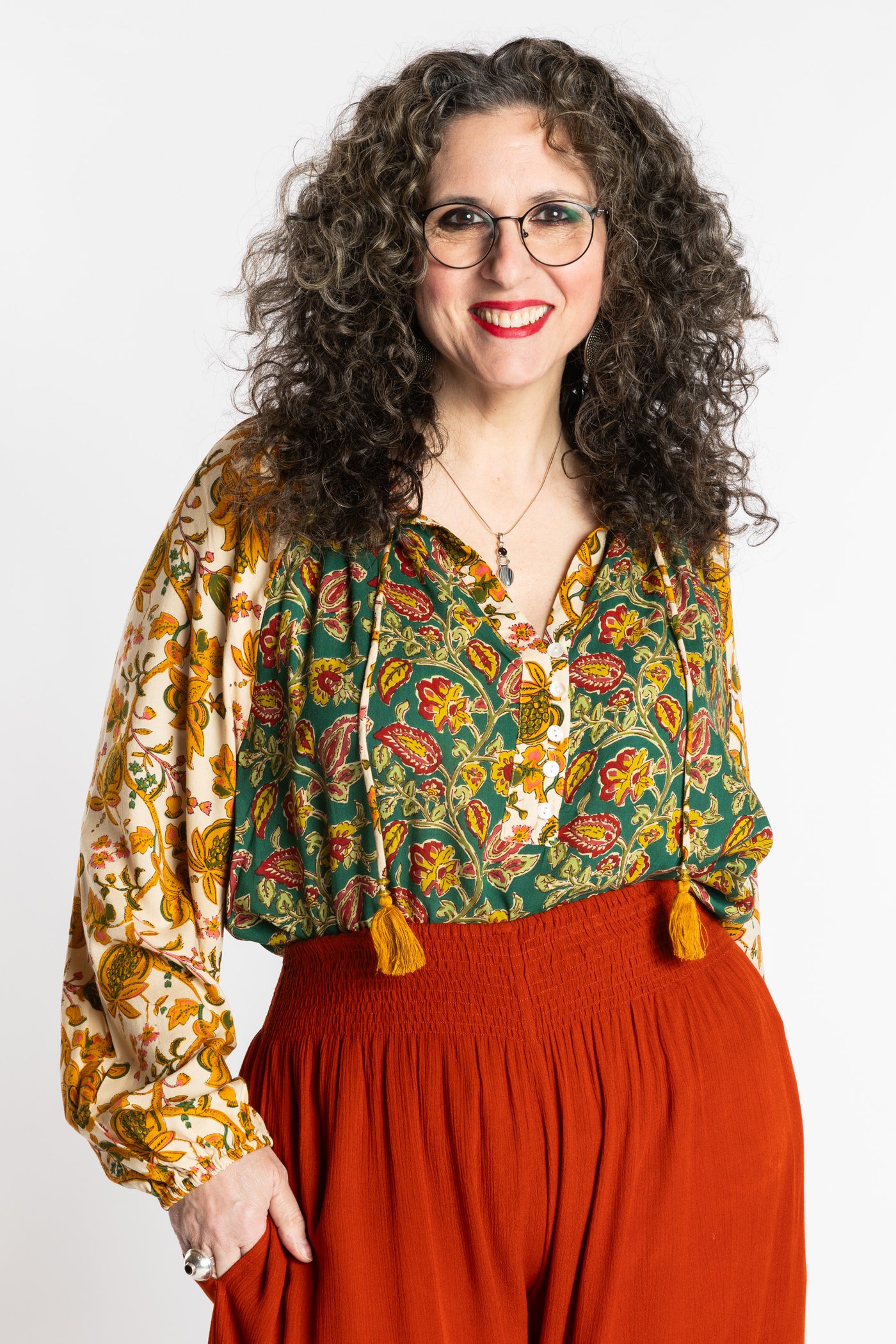 Susan is wearing the mixed print forest green boho floral poet blouse top
