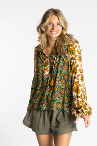 Sophie is wearing the mixed print forest green boho floral poet blouse top
