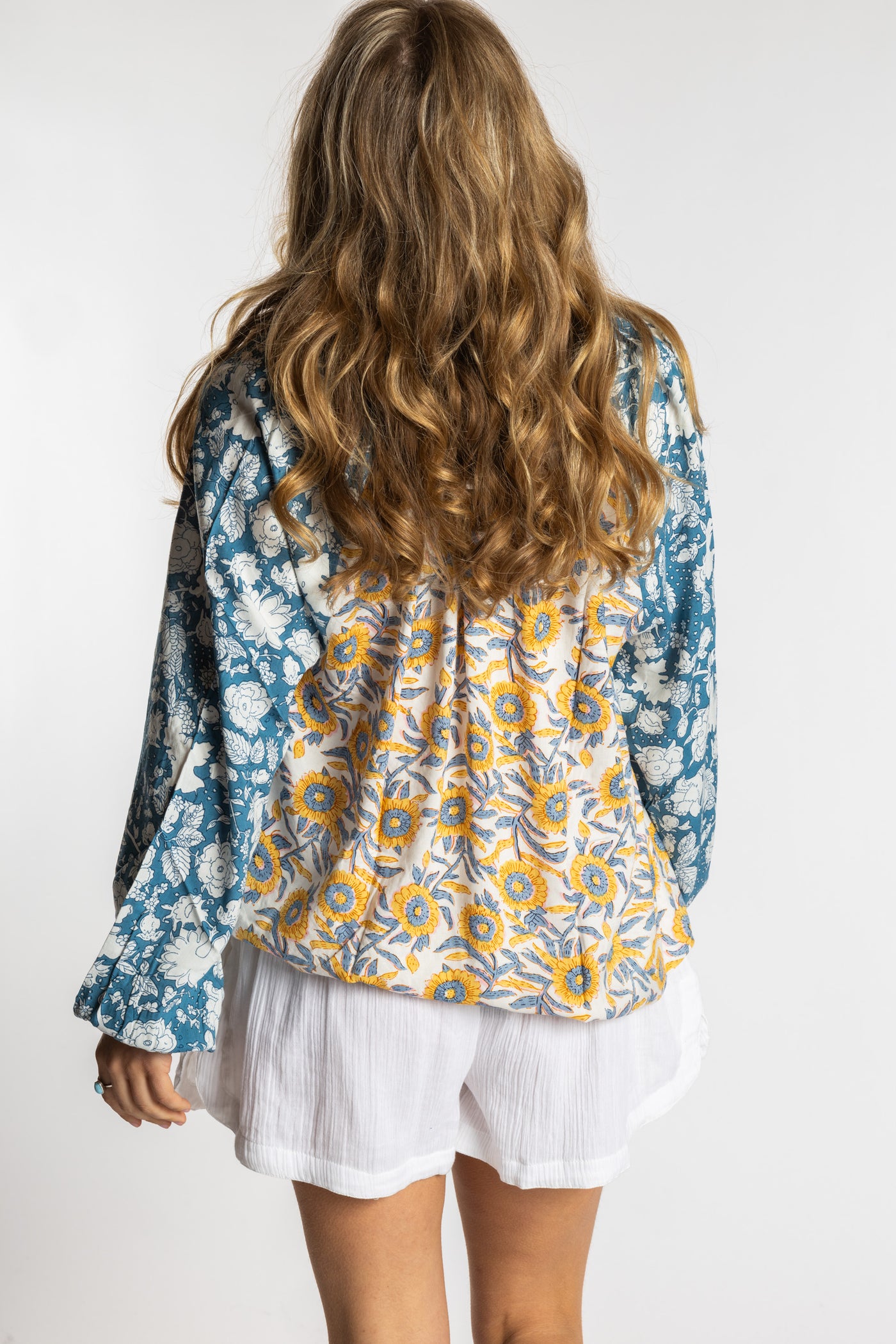 Sophie is wearing the mixed print sunflower boho floral poet blouse top
