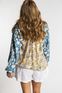 Sophie is wearing the mixed print sunflower boho floral poet blouse top
