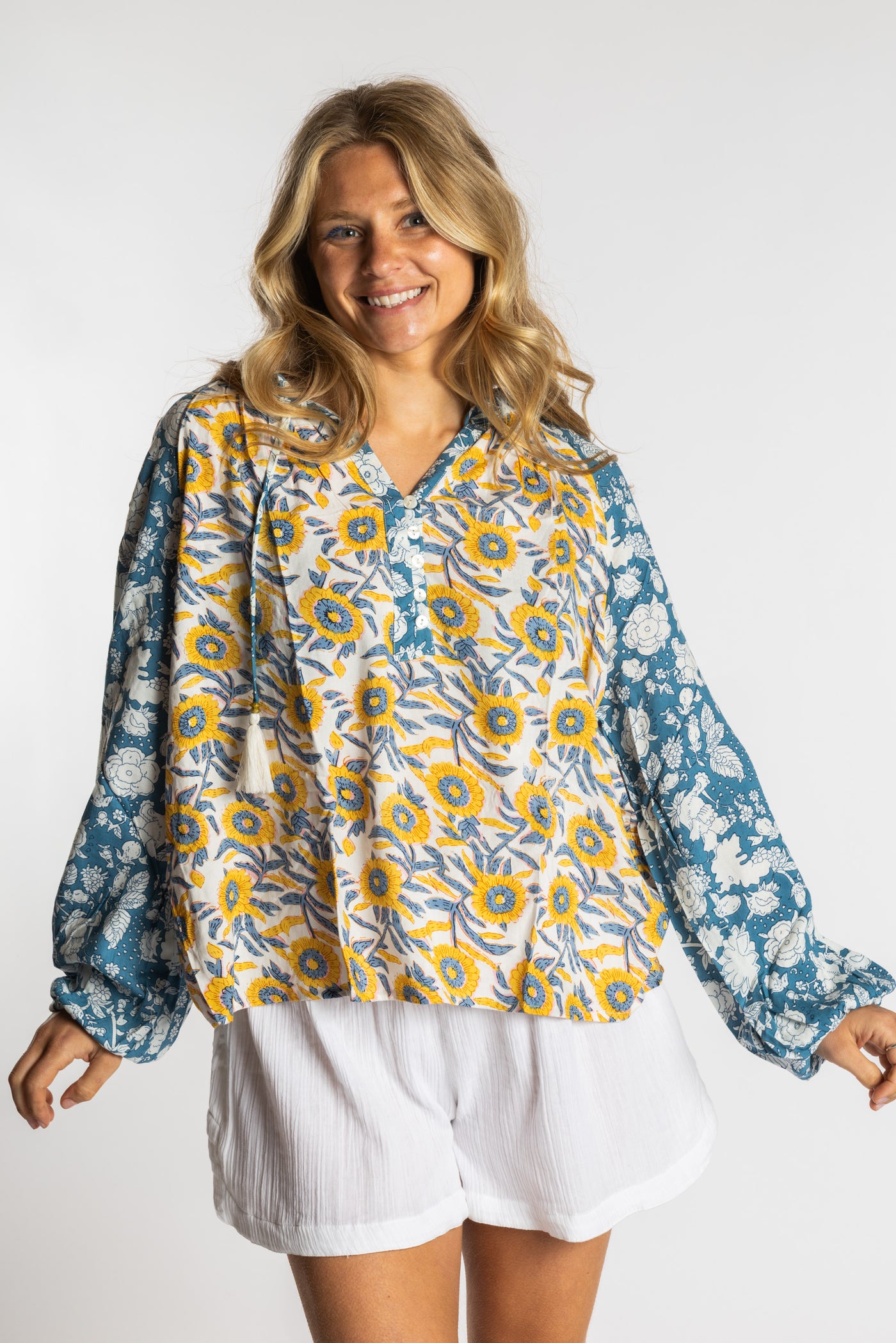 Sophie is wearing the mixed print sunflower boho floral poet blouse top
